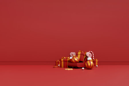 Christmas background with red and white gift boxes, striped ornaments, and candy canes in festive designの写真素材