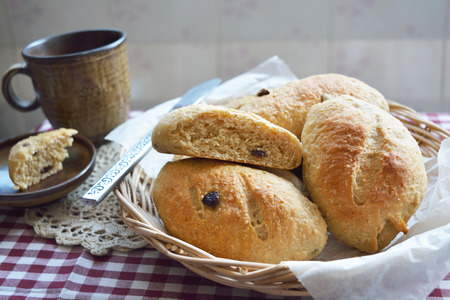 Home made whole wheat bread with raisins in the basketの写真素材