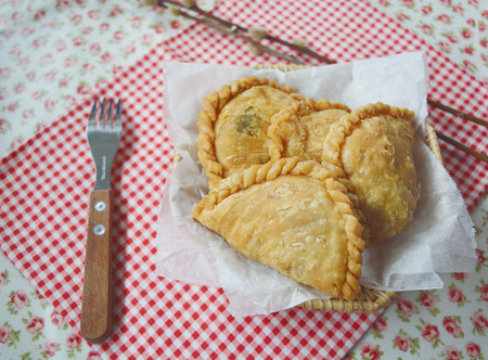 Chicken curry puff in a basketの写真素材