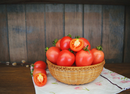 Fresh tomatoes in a basketの写真素材