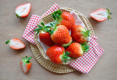 Top view fresh strawberries in a basketの写真素材
