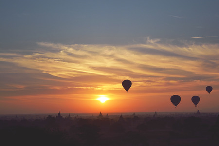 BAGAN, MYANMAR-JANUARY 19: Sunrise with hot air balloons are flying over the pagodas of Bagan on January 19, 2017 in Bagan, Myanmar.の写真素材