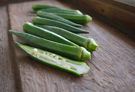 Fresh okra on a woodの写真素材