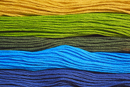 Shade of yarn in yellow, green and blue colourの写真素材