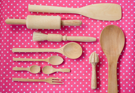 Wood Bakery and kitchen tools on pink polka dot fabricの写真素材