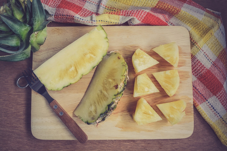 Fresh pineapple cutting slice on wooden cuttingboardの写真素材