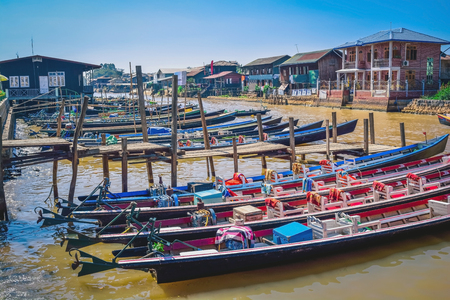 Local boat for tourist stop at the port in Inle lake, Myanmarの写真素材