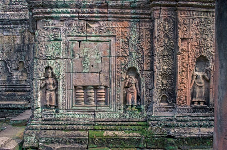 Ancient decoration carving sandstone old Khmer style on the wall in Angor Wat, Siemreap, Cambodiaの写真素材