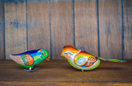 Set of bird animal vintage tin toy on wood backgroundの写真素材