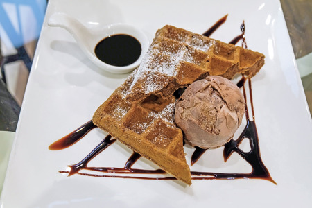 Waffle with chocolate ice-cream and chocolate sauce, dessertの写真素材