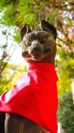 KYOTO, JAPAN %u2013 APRIL 18, 2019: Fox statue decorated in the garden in Fushimi Inari Taisha Shrine, kyoto Japan.のeditorial素材