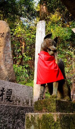 KYOTO, JAPAN %u2013 APRIL 18, 2019: Fox statue decorated in the garden in Fushimi Inari Taisha Shrine, kyoto Japan.のeditorial素材