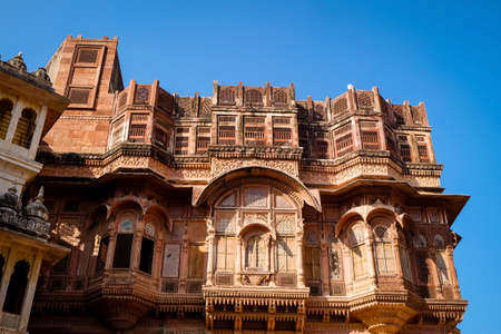 Beautiful details carved facade wall and windows exterior architecture in Mehrangarh fort at Jodhpur Rajasthan, India. Mehrangarh Fort is a world Heritage site.のeditorial素材