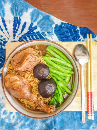 Ramen asian noodle with steamed duck, green vegetables and mushrooms on a bowlの写真素材