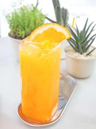 Fresh orange juice on the tableの写真素材