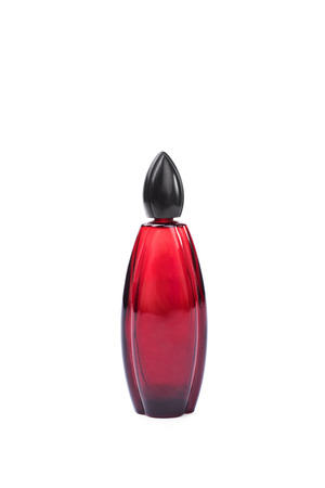 Close-up shot of a red colored perfume bottle isolated on white backgroundの写真素材
