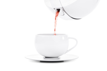 Pouring tea isolated on white backgroundの写真素材