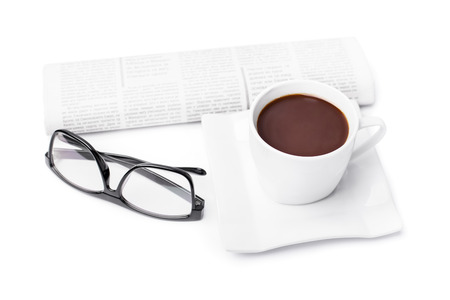 Cup of coffee with a newspaper and glasses isolated on white backgroundの写真素材