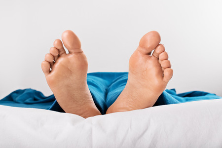 Resting women feet isolated on a white backgroundの写真素材