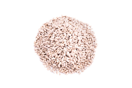 Top perspective on a heap of sunflower seeds isolated on white backgroundの写真素材