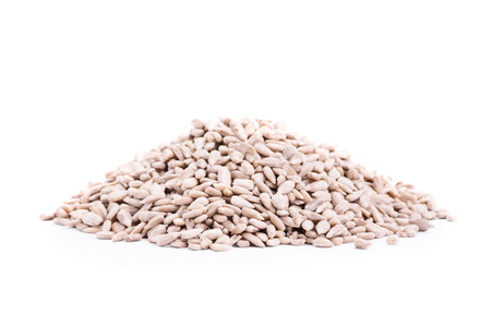 Heap of sunflower seeds isolated on white backgroundの写真素材