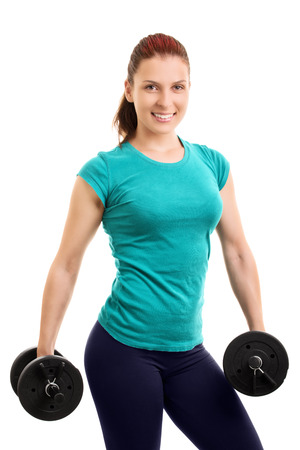 The looks. Young athlete holding two dumbbells, isolated on white background.の写真素材