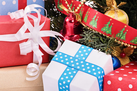 A close up shot of Christmas decorations, ornaments and a Christmas tree.の写真素材