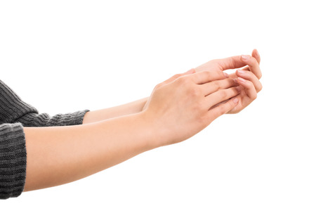 A close up shot of female hands clapping, isolated on white background.の写真素材