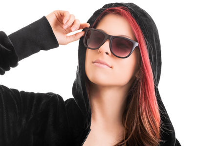 A portrait of a beautiful stylish girl with sunglasses, isolated on white background.の写真素材