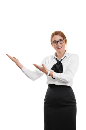 A portrait of a smiling business woman, gesturing with her hands, isolated on white background.の写真素材
