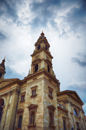 Close up side view of St. Stephen's Basilica in Budapest on a cloudy day.の写真素材