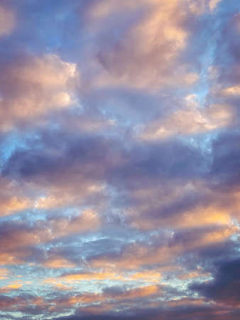 Beautiful dramatic sky painted by the sun leaving bright golden and purple shades. Dramatic sunset and sunrise sky. Beautiful sunset sky with dramatic light.の写真素材