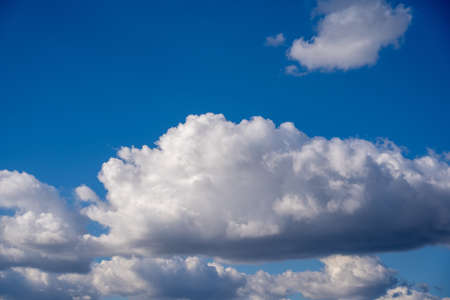 Beautiful blue sky with fluffy white clouds. Wonderful summer or spring day with clear sky and white clouds.の写真素材