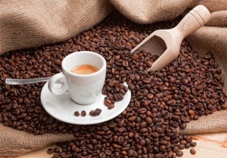 cup of coffee on coffee beansの写真素材