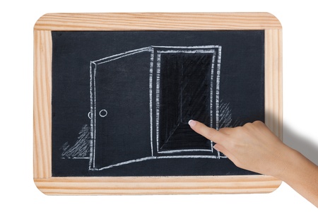 Open door drawing on black boardの写真素材