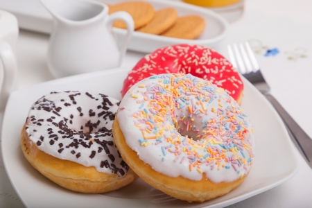Donuts on white plateの写真素材