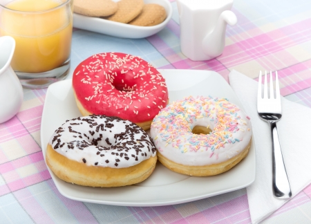 Donuts on white plate の写真素材