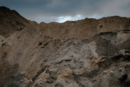 Mountain of sand in a construction yardの写真素材