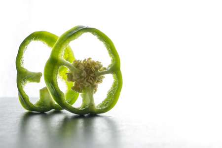 Green pepper sliced ??isolated on white backgroundの写真素材
