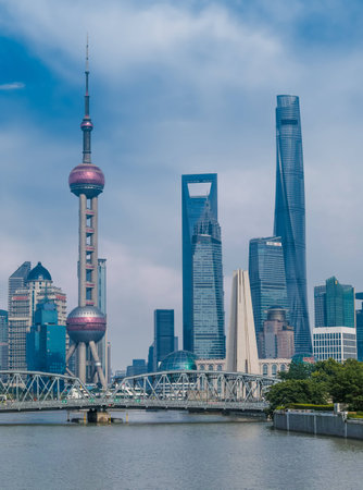 Shanghai, China - May 30, 2017: A afternoon view of the skyscrapers of Lujiazui Pudong New Area at east bank of Huangpu River, looking from the Bund at west side of the river, in central Shanghai, Chinaのeditorial素材