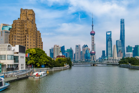 Shanghai, China - May 30, 2017: A afternoon view of the skyscrapers of Lujiazui Pudong New Area at east bank of Huangpu River, looking from the Bund at west side of the river, in central Shanghai, Chinaのeditorial素材