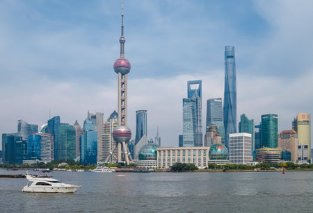 Shanghai, China - May 30, 2017: A afternoon view of the skyscrapers of Lujiazui Pudong New Area at east bank of Huangpu River, looking from the Bund at west side of the river, in central Shanghai, Chinaのeditorial素材