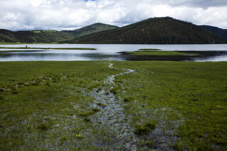 Green Hills and clear waters of pudatsoの写真素材