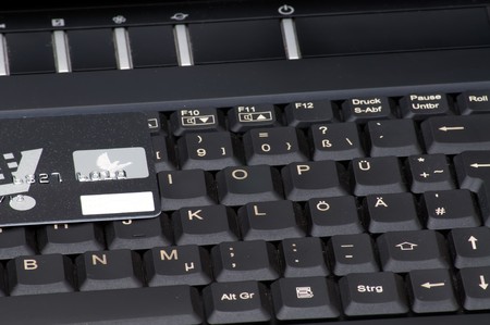 A laptop and a creditcard as a symbol for shopping in the world wide web.