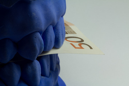 Total prosthesis in blue and with banknoteの写真素材