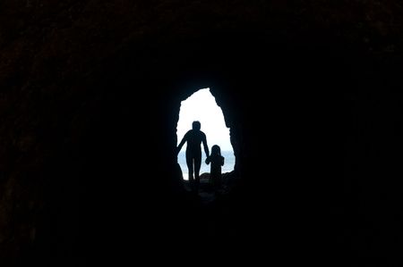 Walking through tunnel to the light, Oceanside Beach, Washingtonの写真素材