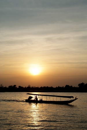 The iongtail taxi boat on sunset.の写真素材