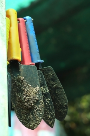A shovels hanging on a pole ready for plants.の写真素材