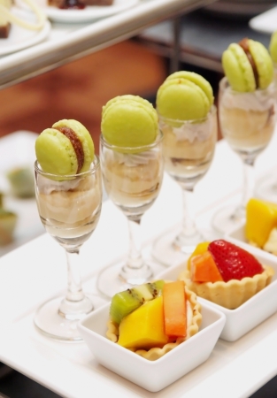Fruit tart and macaroon with cream in cocktail partyの写真素材