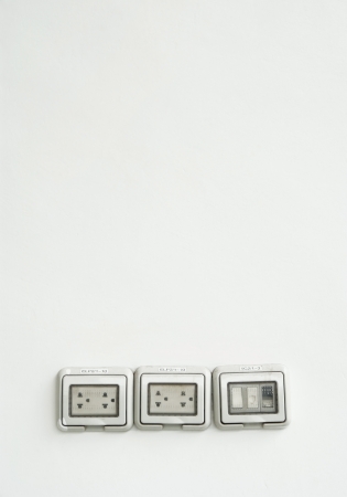 Plug and switch on white backgroundの写真素材